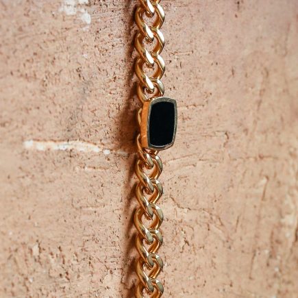 Onyx Bracelet laying flat down a wall