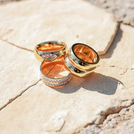Spotlight ring stacked, with Be Extra ring, and Goals ring on stone