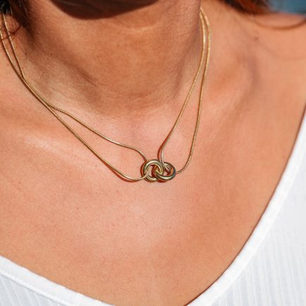 Double life necklace zoomed in view on model