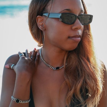 Model wearing onyx necklace and onyx bracelet